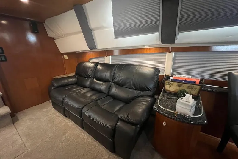 Kiki's Tiki Yacht Photos Pics Luxurious interior of 2000 Carver 506 Motor Yacht with leather seating and elegant decor.