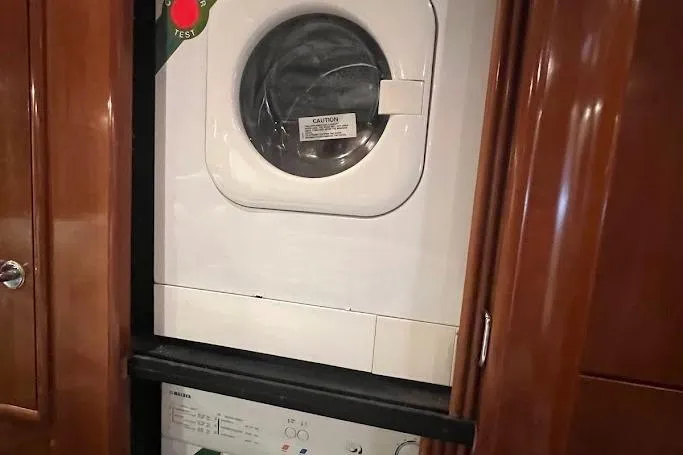 Kiki's Tiki Yacht Photos Pics Washer and dryer unit inside a 2000 Carver 506 Motor Yacht.