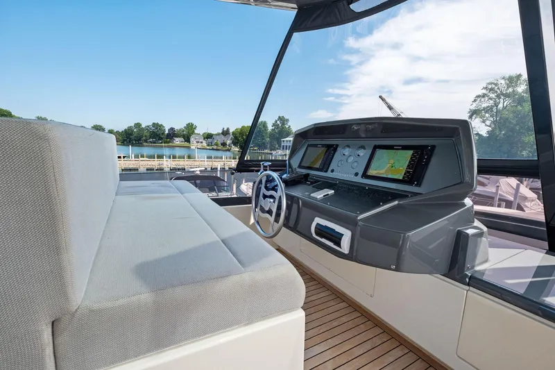 She Said Yes! Again Yacht Photos Pics Helm of 2018 Ferretti Yachts 780 with modern navigation equipment and scenic water view.