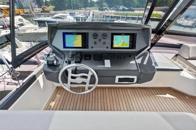 She Said Yes! Again Yacht Photos Pics Helm of 2018 Ferretti Yachts 780 with navigation screens and controls.