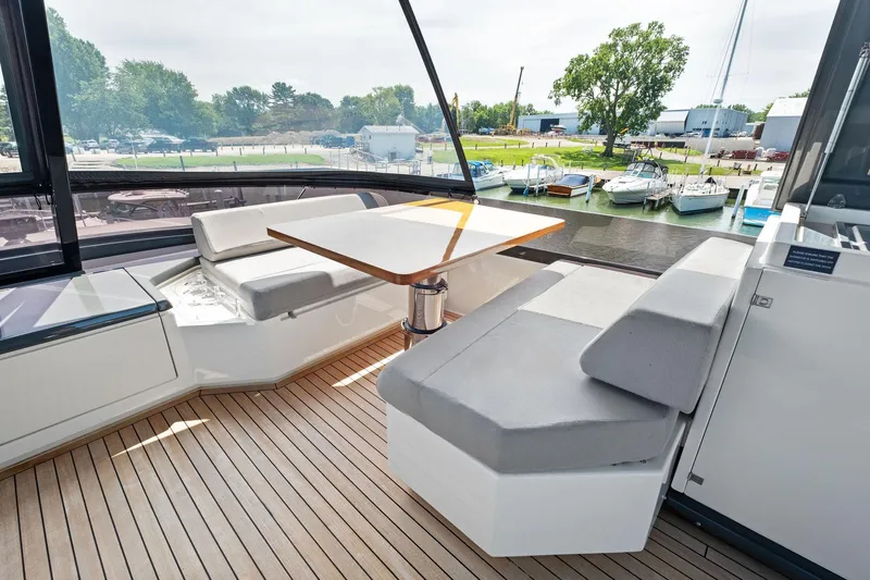 She Said Yes! Again Yacht Photos Pics Luxurious seating area on 2018 Ferretti Yachts 780 with marina view.