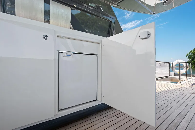 She Said Yes! Again Yacht Photos Pics Open storage compartment on 2018 Ferretti Yachts 780 deck, showcasing sleek design and functionality.