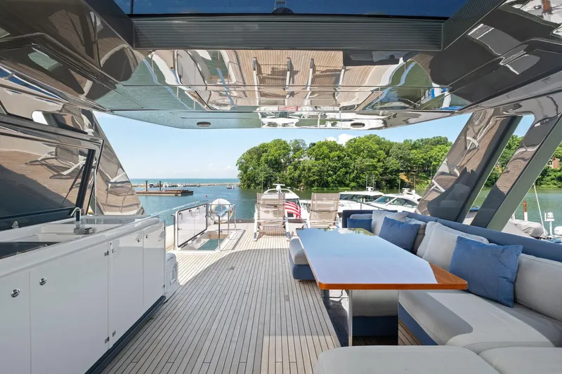 She Said Yes! Again Yacht Photos Pics Luxurious 2018 Ferretti Yachts 780 deck with elegant seating and scenic waterfront view.