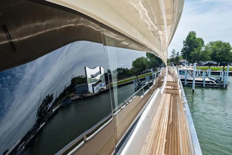 She Said Yes! Again Yacht Photos Pics 2018 Ferretti Yachts 780 reflecting water and dock, showcasing sleek design and luxury.
