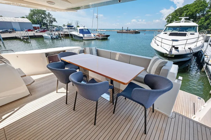 She Said Yes! Again Yacht Photos Pics Outdoor dining area on 2018 Ferretti Yachts 780, featuring elegant seating and waterfront view.