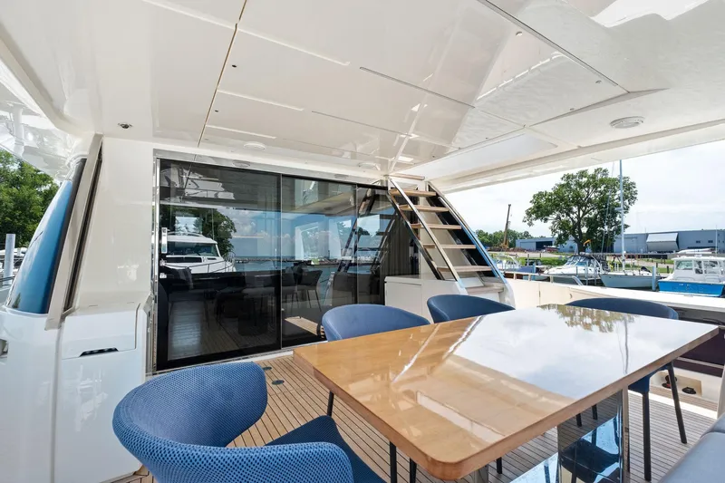 She Said Yes! Again Yacht Photos Pics Luxurious 2018 Ferretti Yachts 780 deck with elegant seating and polished table.