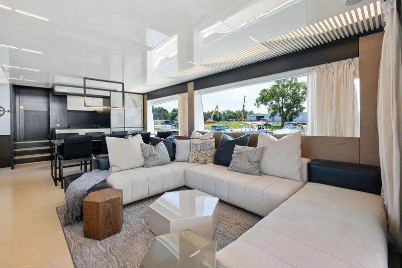 She Said Yes! Again Yacht Photos Pics Luxurious interior of 2018 Ferretti Yachts 780 with modern seating and large windows.