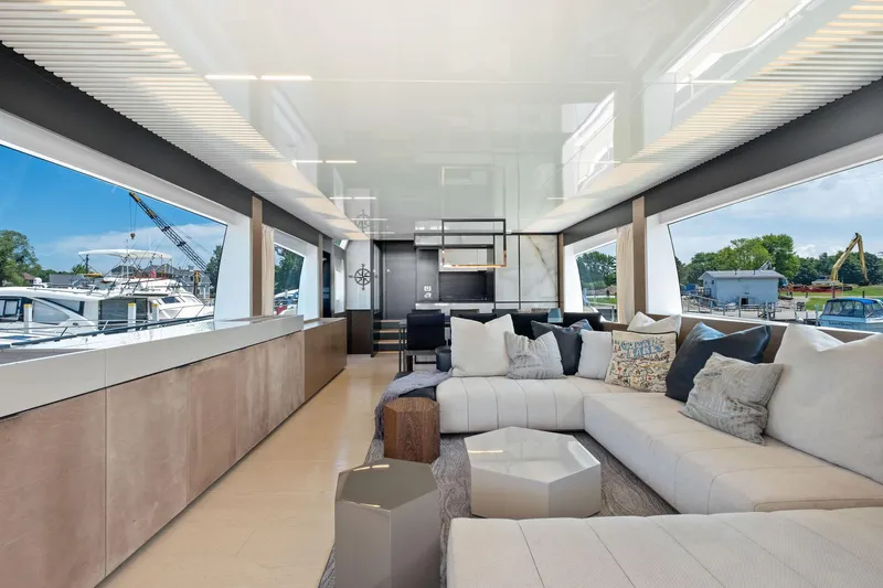 She Said Yes! Again Yacht Photos Pics Luxurious interior of 2018 Ferretti Yachts 780 with modern seating and large windows.