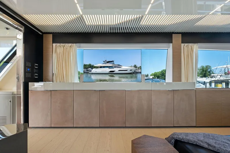 She Said Yes! Again Yacht Photos Pics Luxurious interior of 2018 Ferretti Yachts 780 with large window view of yacht.