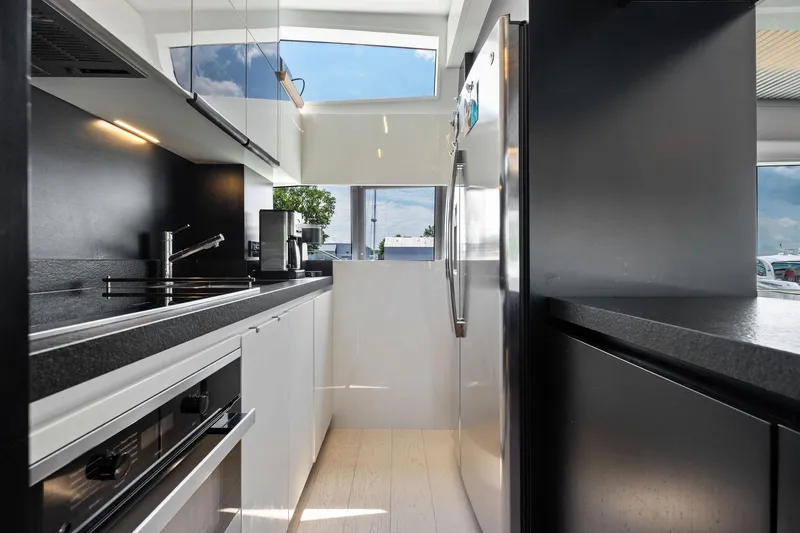 She Said Yes! Again Yacht Photos Pics Modern kitchen interior on 2018 Ferretti Yachts 780, featuring sleek appliances and minimalist design.