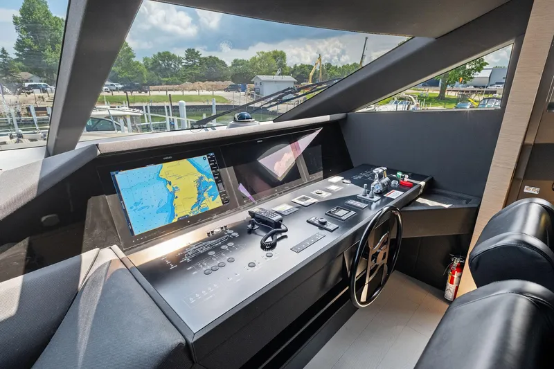 She Said Yes! Again Yacht Photos Pics Helm of 2018 Ferretti Yachts 780 with navigation screens and controls.