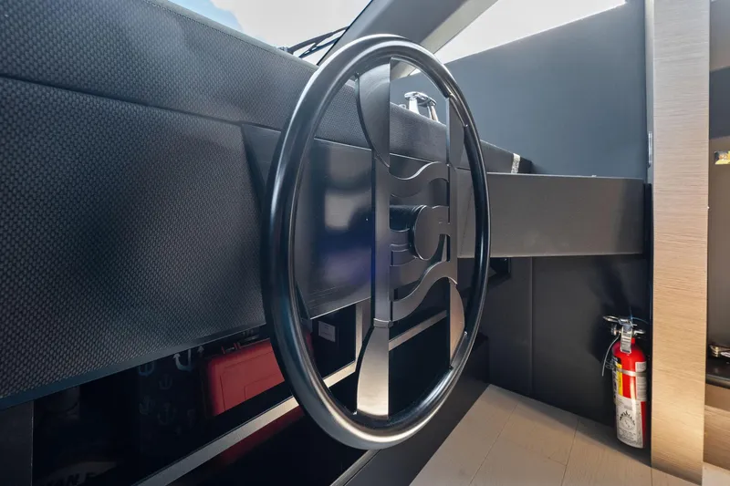 She Said Yes! Again Yacht Photos Pics Steering wheel of 2018 Ferretti Yachts 780, featuring modern design and safety equipment.