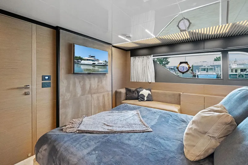She Said Yes! Again Yacht Photos Pics Luxurious bedroom interior of 2018 Ferretti Yachts 780 with modern decor and large window.