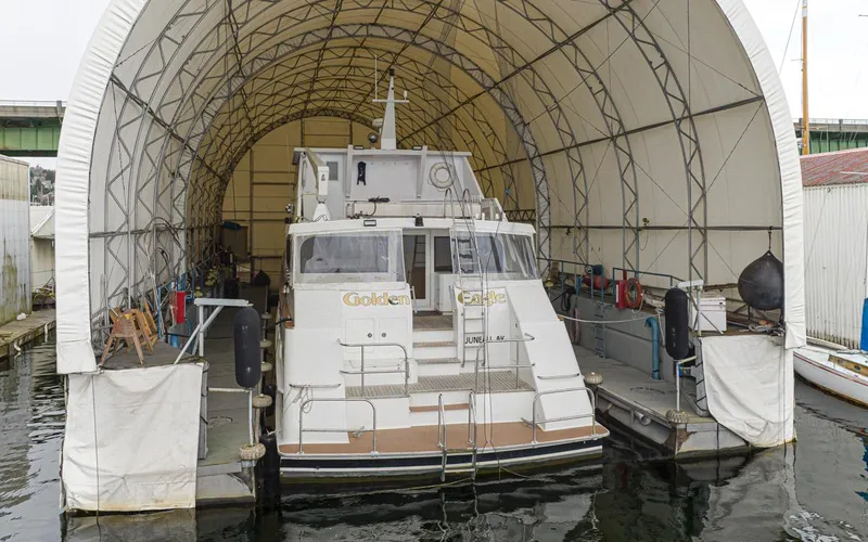 Eagles Nest Yacht Photos Pics Custom 2005 boathouse with dry dock sheltering a large boat.