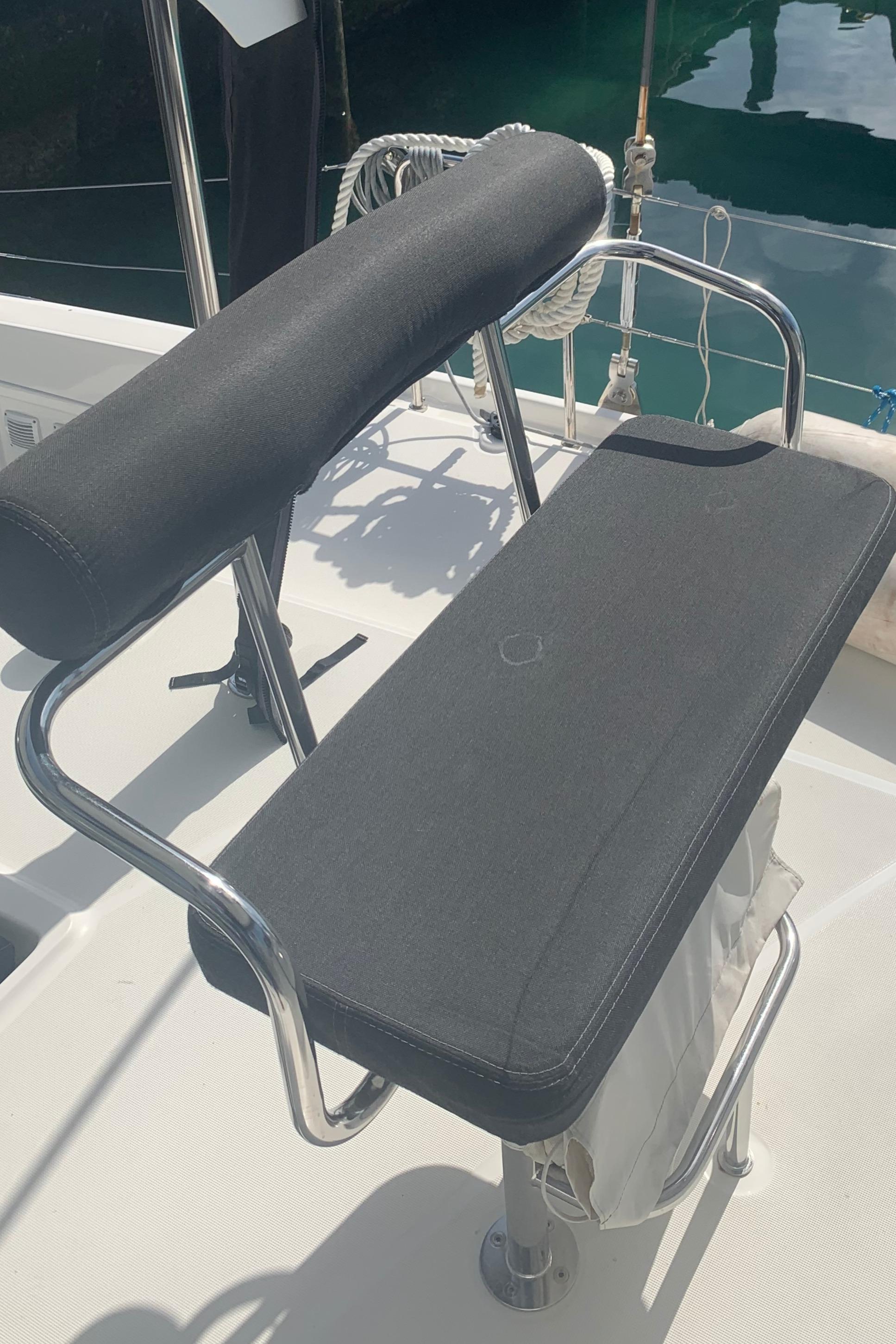 Helm seat on 2019 Lagoon 42 catamaran, featuring sleek design and comfortable padding.