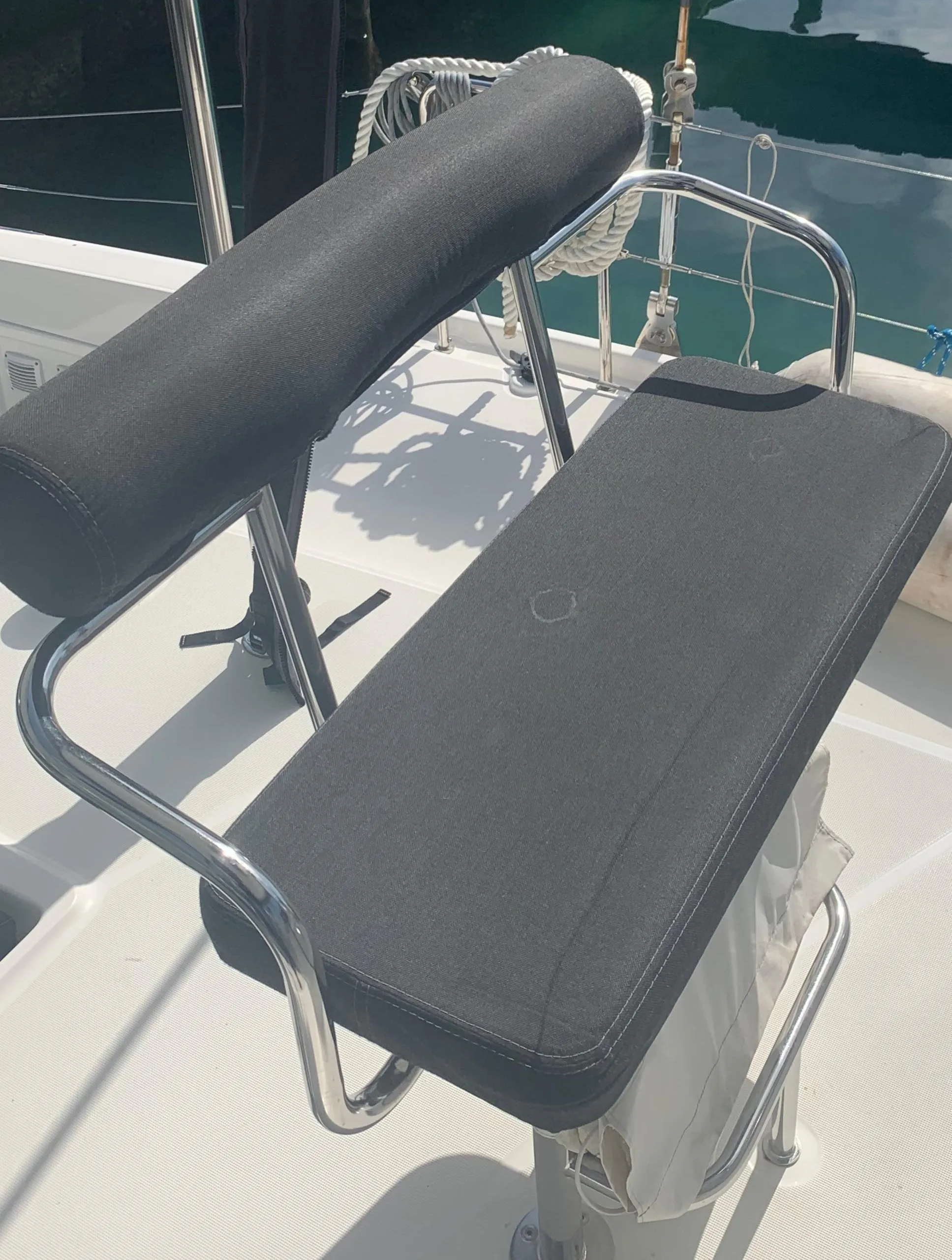 Helm seat on 2019 Lagoon 42 catamaran, featuring sleek design and comfortable padding.