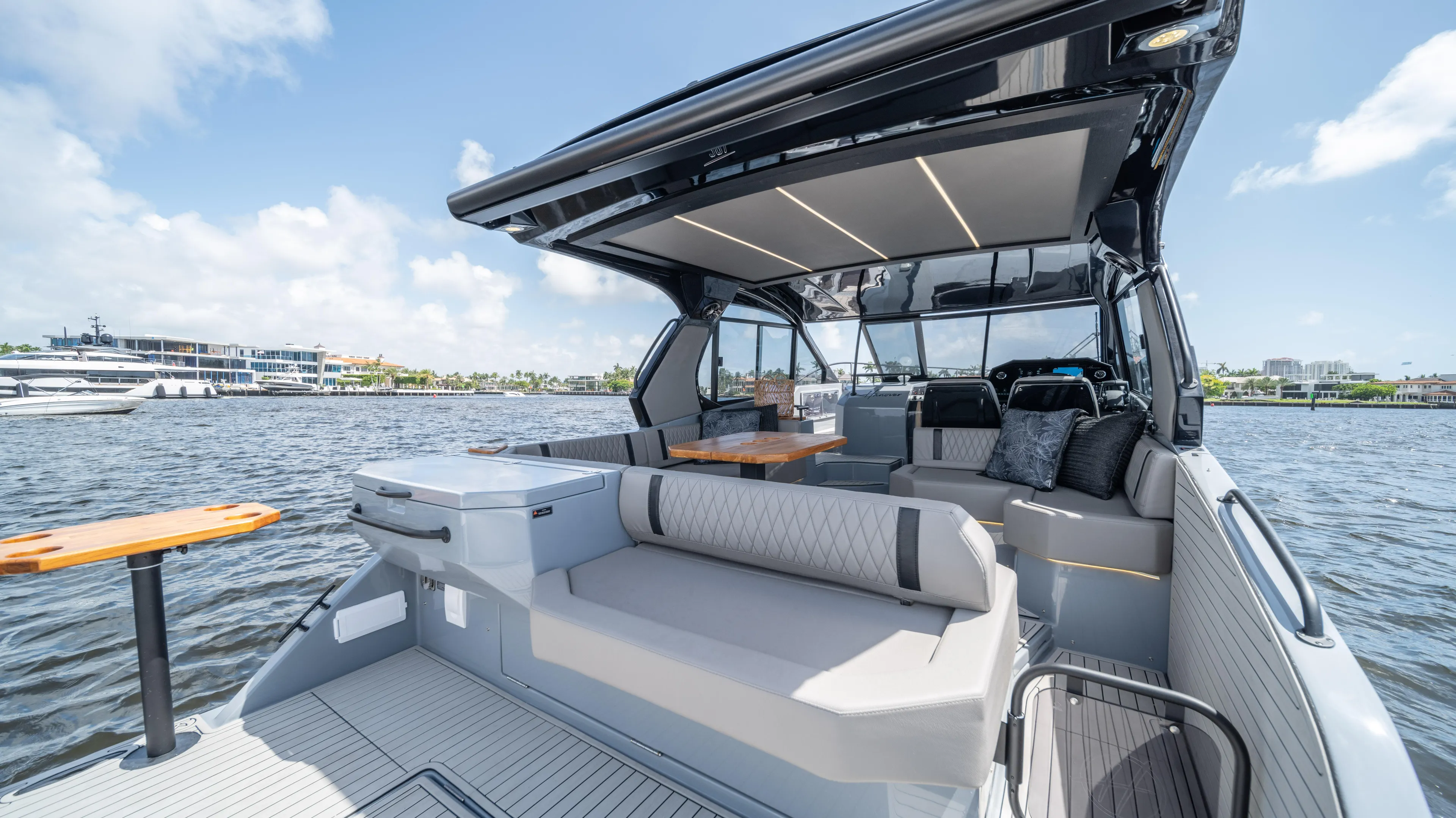 Custom Order Yours Today! Yacht Photos Pics Luxurious 2025 Hanover 387 Outboard boat with spacious seating and modern design on the water.