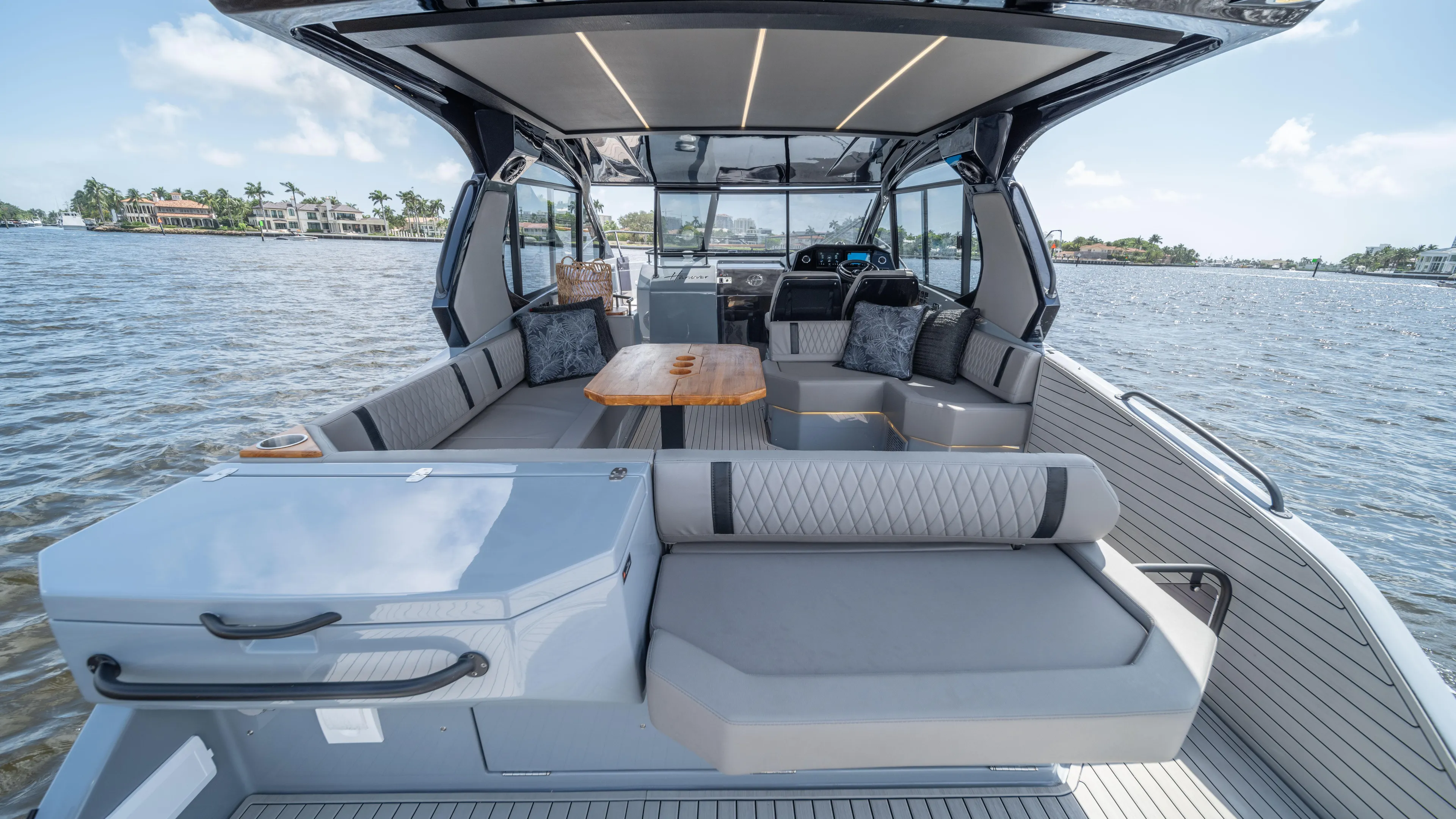 Custom Order Yours Today! Yacht Photos Pics Luxurious 2025 Hanover 387 Outboard boat interior with spacious seating and modern design on the water.