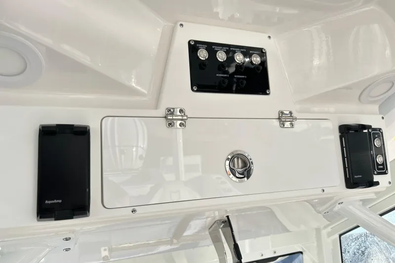  Yacht Photos Pics 2026 Sea Fox 288 Commander dashboard with control panel and storage compartment.