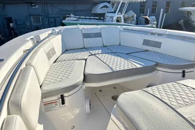  Yacht Photos Pics 2026 Sea Fox 288 Commander boat with cushioned seating and sleek design.
