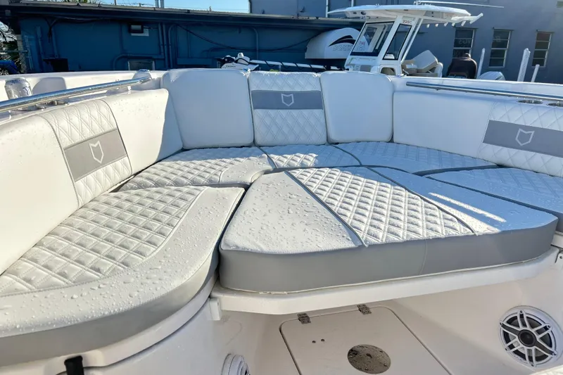  Yacht Photos Pics Luxurious seating on 2026 Sea Fox 288 Commander boat, featuring quilted upholstery and modern design.