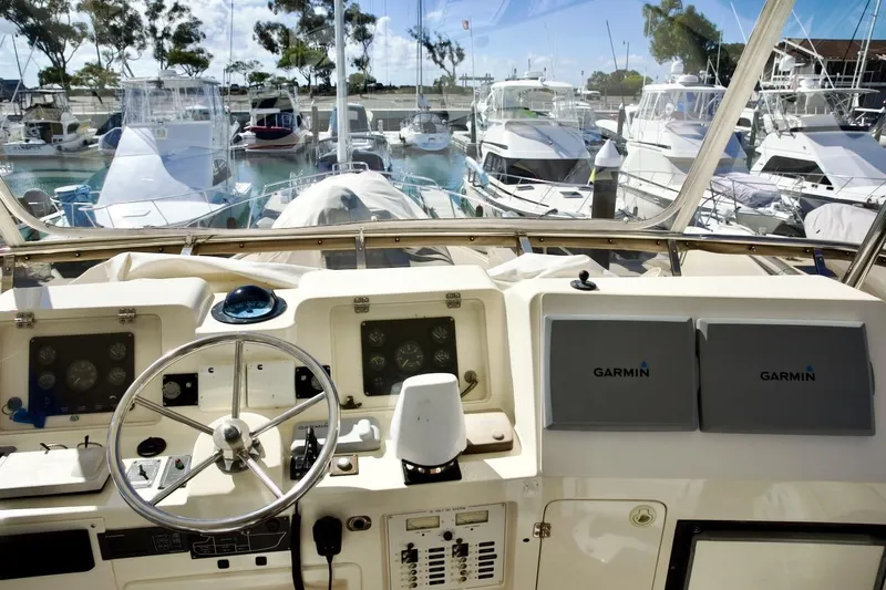The Donut Hull Yacht Photos Pics Cockpit view of 2002 Mikelson 50 Sportfisher yacht with Garmin navigation systems.