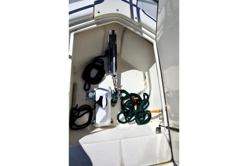 The Donut Hull Yacht Photos Pics Anchor locker of 2002 Mikelson 50 Sportfisher with ropes and equipment.