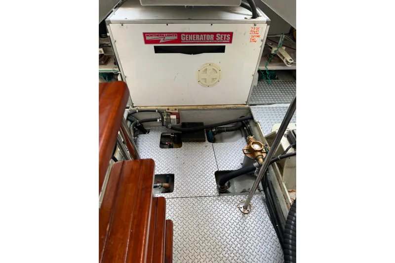 The Donut Hull Yacht Photos Pics Engine room of 2002 Mikelson 50 Sportfisher with Northern Lights generator.