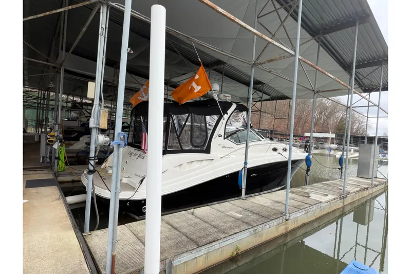  Yacht Photos Pics 2007 Sea Ray 340 Sundancer docked in a covered marina slip.