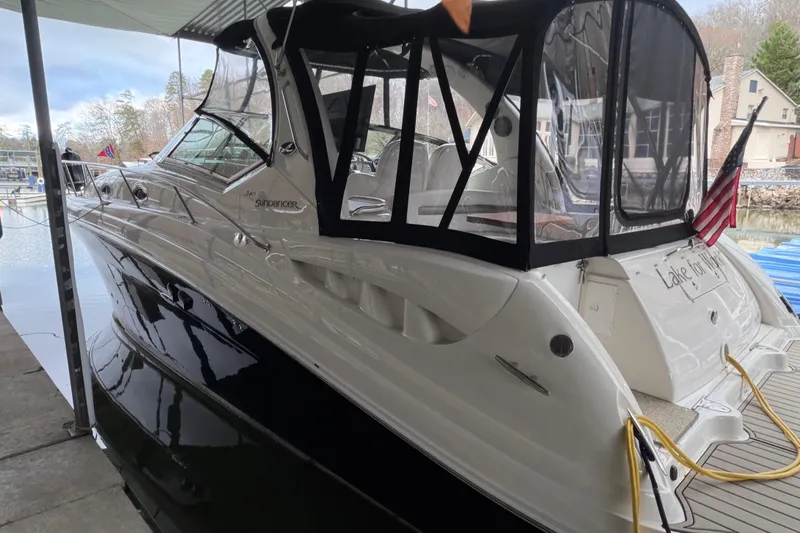  Yacht Photos Pics 2007 Sea Ray 340 Sundancer docked, featuring sleek design and covered cockpit.