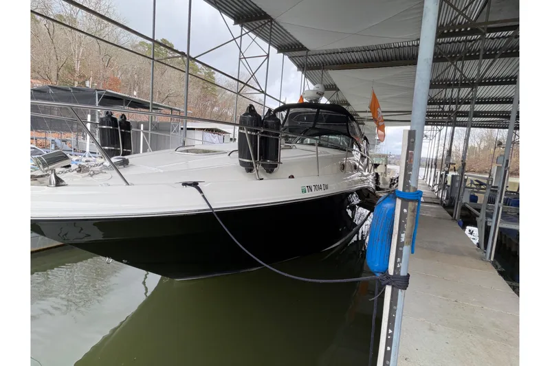  Yacht Photos Pics 2007 Sea Ray 340 Sundancer docked under a covered marina.