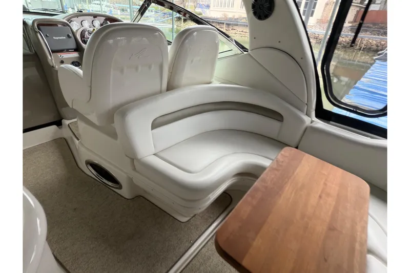  Yacht Photos Pics 2007 Sea Ray 340 Sundancer interior with white seating and wooden table.