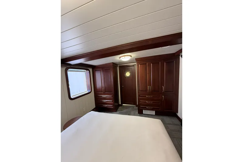 Anne S Pierce Yacht Photos Pics Luxurious ship cabin with wooden furnishings, Custom Glovertown Shipyard 2021 model.