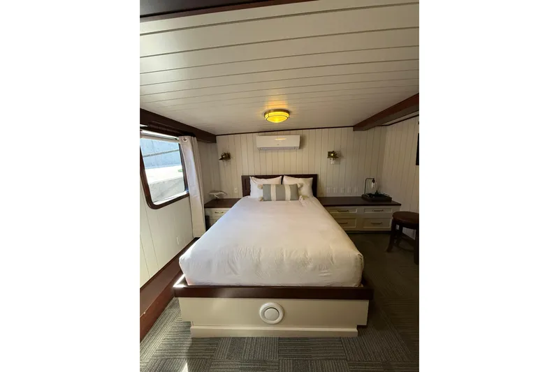Anne S Pierce Yacht Photos Pics Luxurious ship cabin interior with a cozy bed, Custom Glovertown Shipyard 2021 model.