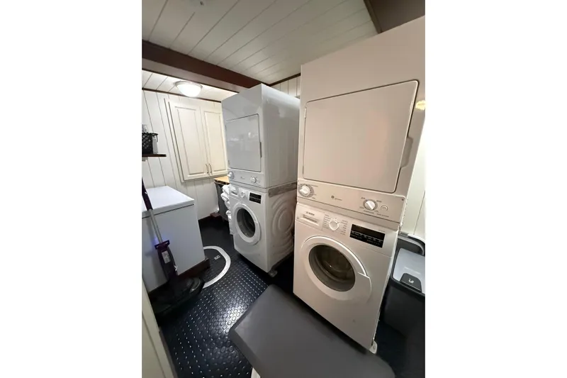 Anne S Pierce Yacht Photos Pics Laundry room with stacked washer and dryer, Custom Glovertown Shipyard, 2021.