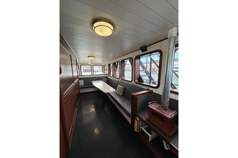 Anne S Pierce Yacht Photos Pics Interior of 2021 Custom Glovertown Shipyard boat with seating and windows.