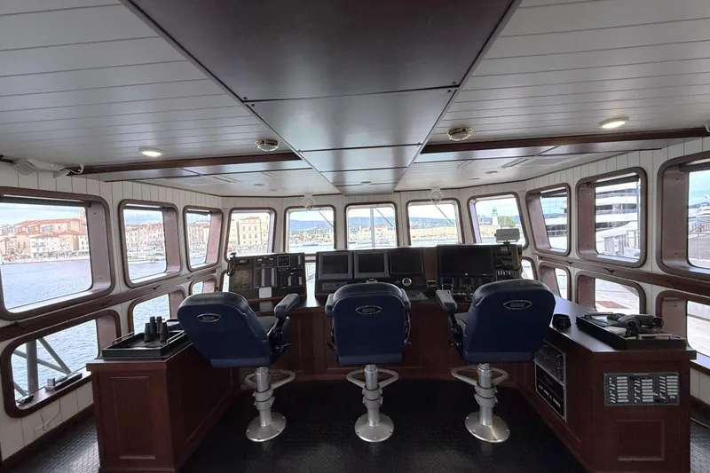 Anne S Pierce Yacht Photos Pics Bridge interior of 2021 Custom Glovertown Shipyard vessel with panoramic windows and control panels.