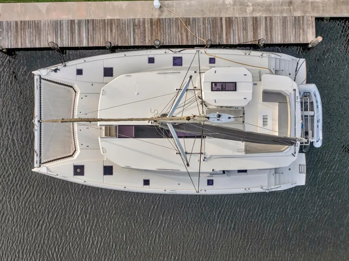  Yacht Photos Pics Aerial view of a 2021 Leopard 50 catamaran docked at a pier.