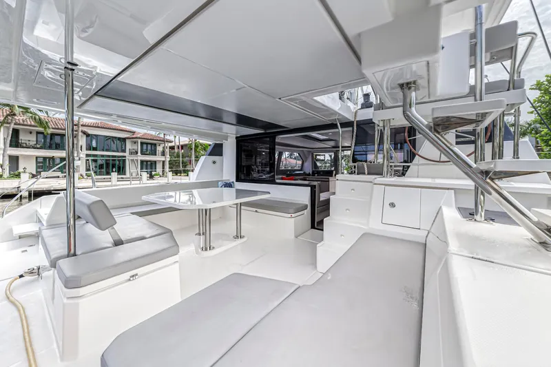  Yacht Photos Pics Luxurious Leopard 50 catamaran interior, featuring modern seating and dining area, 2021 model.