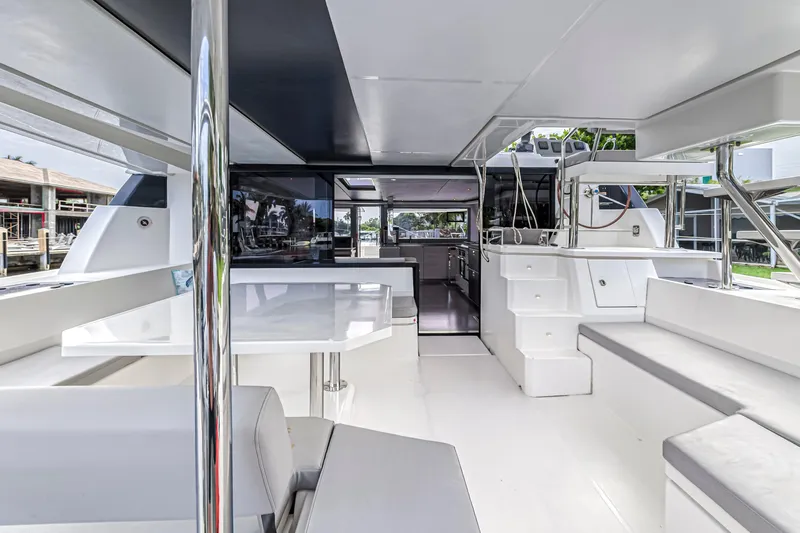  Yacht Photos Pics Modern interior of 2021 Leopard 50 yacht with sleek seating and dining area.