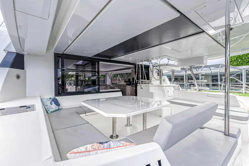  Yacht Photos Pics Luxurious 2021 Leopard 50 yacht interior with modern seating and dining area.
