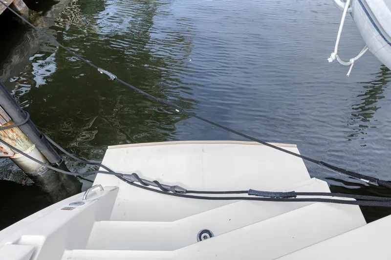  Yacht Photos Pics Stern view of 2021 Leopard 50 yacht docked by water.