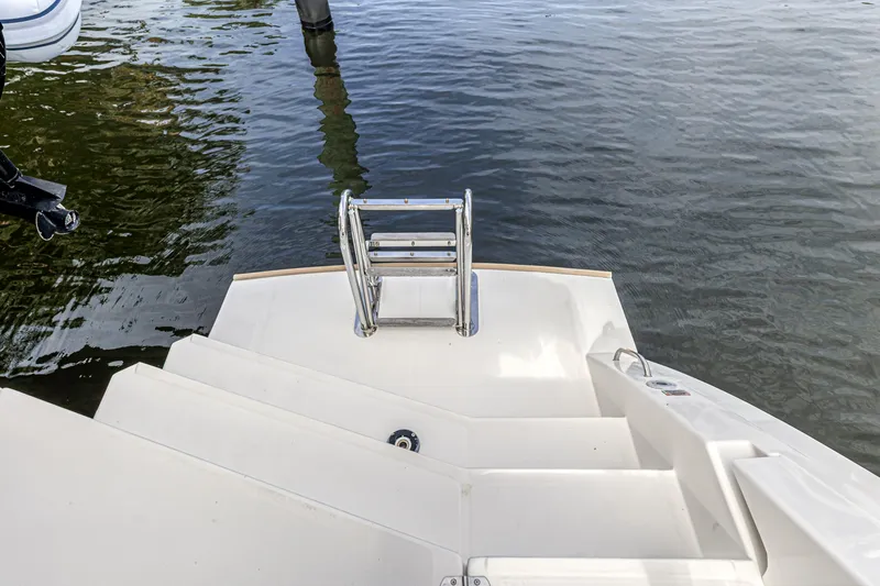  Yacht Photos Pics Leopard 50 yacht swim platform with ladder, 2021 model, on calm water.