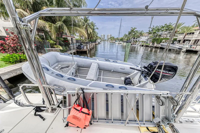  Yacht Photos Pics Inflatable boat on Leopard 50 yacht, docked in a scenic canal, 2021 model.