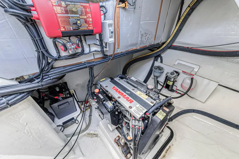  Yacht Photos Pics Engine room of a 2021 Leopard 50 yacht, featuring a Yanmar engine and electrical components.