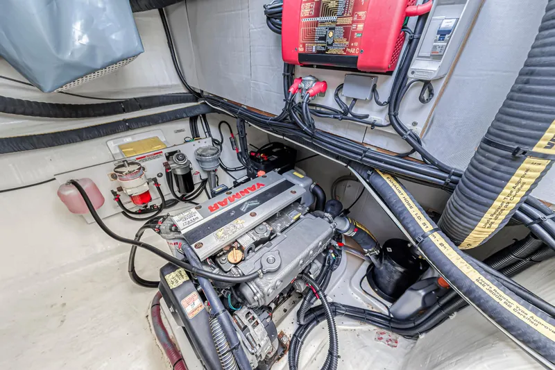  Yacht Photos Pics Engine room of a 2021 Leopard 50 yacht, featuring a Yanmar engine and electrical components.