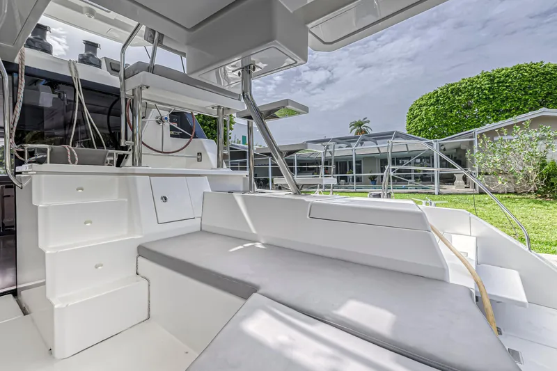  Yacht Photos Pics Modern Leopard 50 yacht interior, 2021 model, featuring sleek seating and outdoor view.