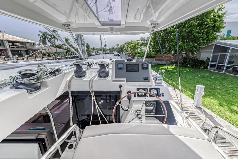  Yacht Photos Pics Helm of 2021 Leopard 50 yacht with modern controls and lush surroundings.