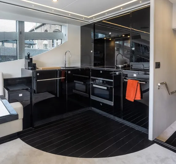  Yacht Photos Pics Modern kitchen interior of 2026 Van der Valk Beach Club 600 yacht with sleek black cabinetry.