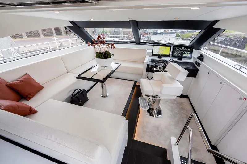  Yacht Photos Pics Luxurious interior of 2026 Van der Valk Beach Club 600 yacht with modern helm and seating area.